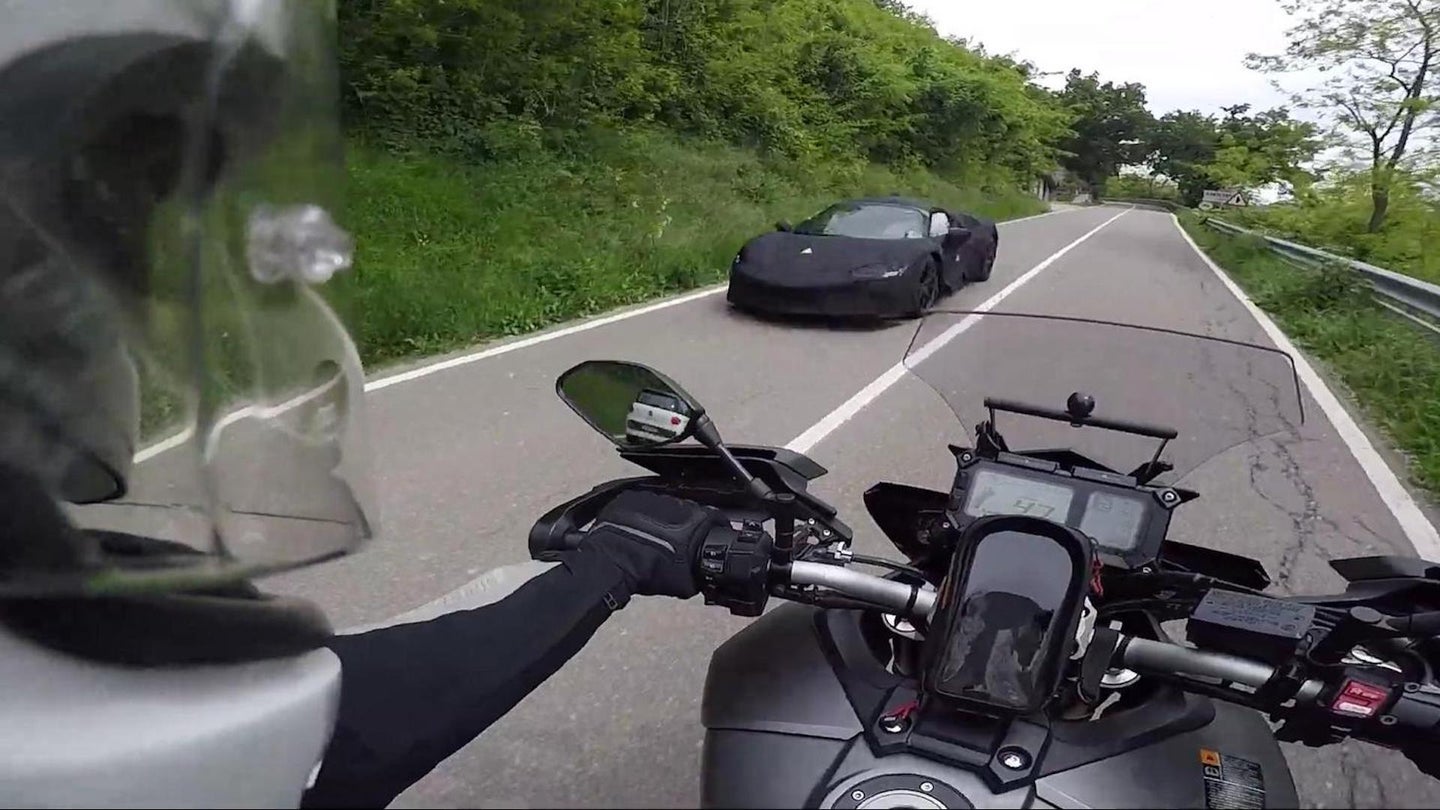 Watch Ferrari’s Upcoming Hybrid Supercar Get Chased by a Motorcycle Around Maranello