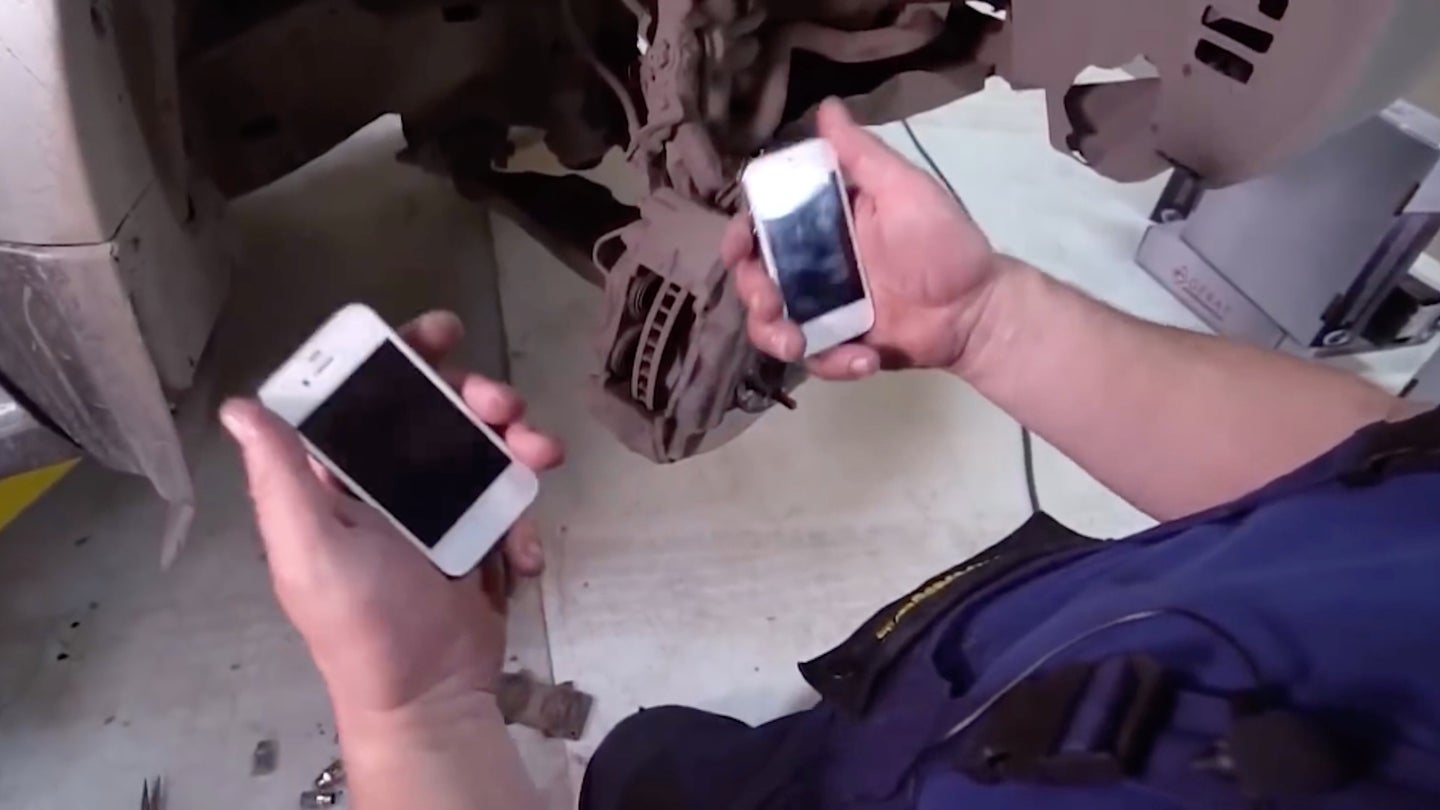 Watch These Hackjob Mechanics Replace a Toyota SUV’s Brake Pads With iPhones