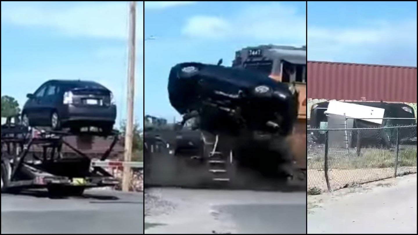 Watch a Toyota Prius Get Punted off a Trailer After Train Crashes Into Semi Truck
