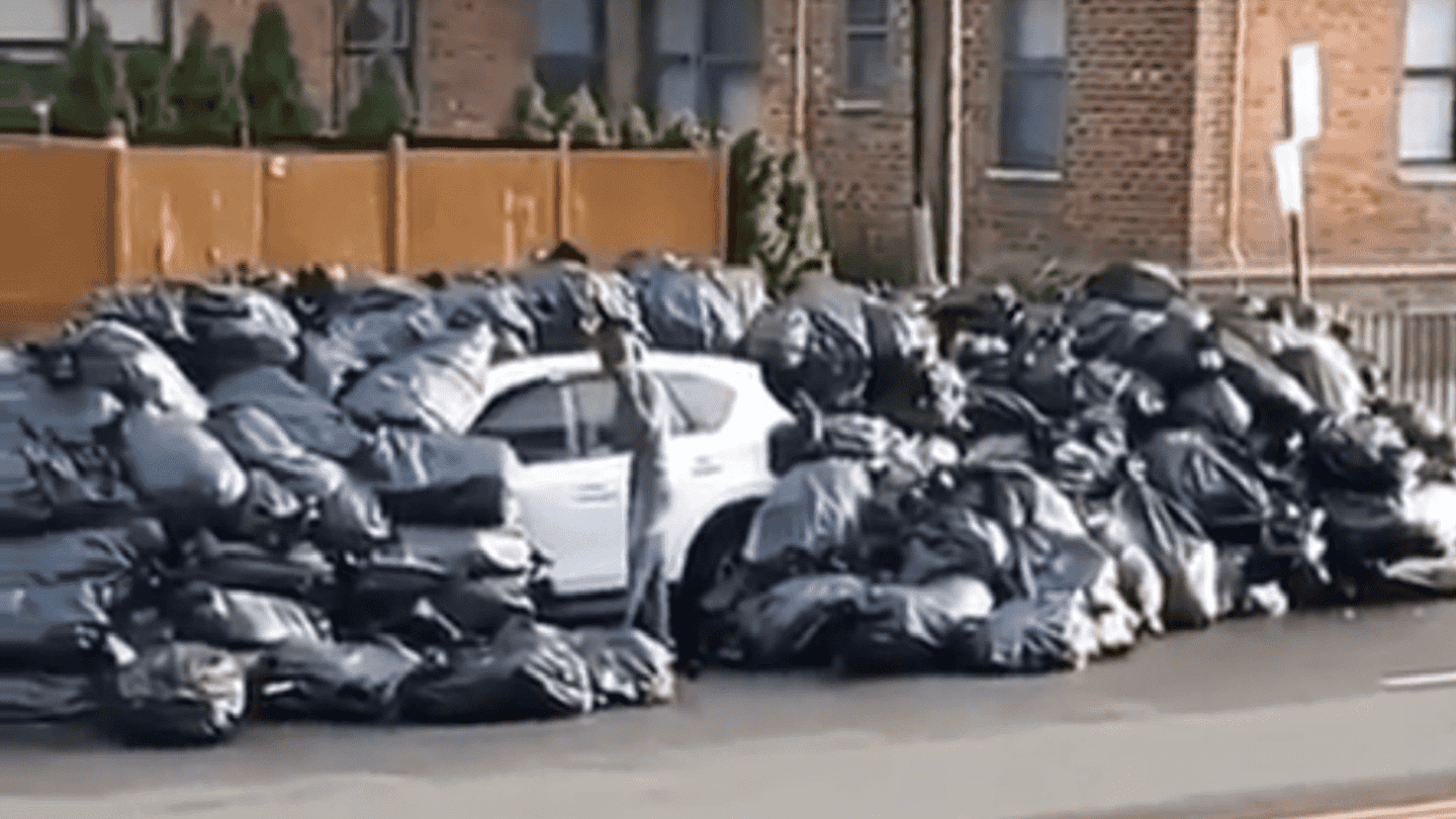SUV Buried in Tons of Trash After Parking in the Wrong Spot in New York City