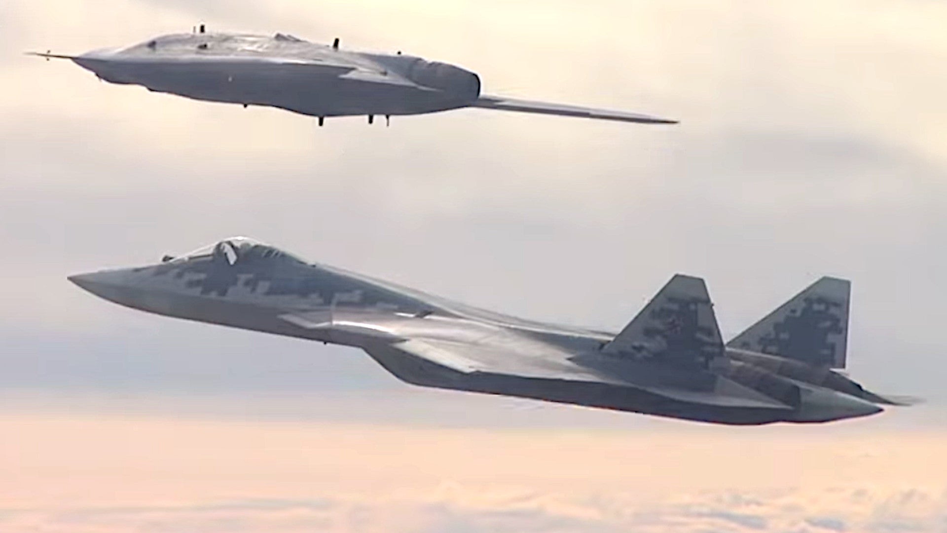 Watch Russia&#39;s S-70 Unmanned Combat Air Vehicle Fly With An Su-57 For The First Time