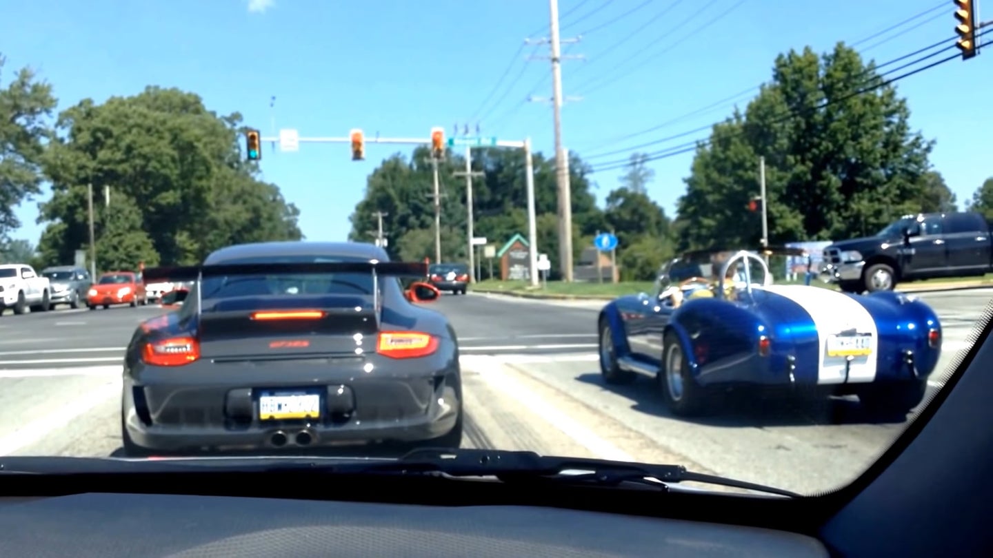 Watch a Porsche 911 GT3 RS Roast Its Clutch Trying to Drag Race a Shelby Cobra