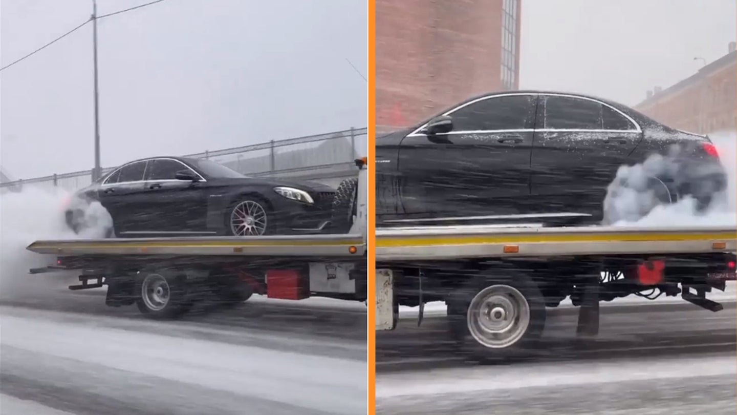 Watch: Mercedes-AMG C63 S Breaks Straps While Ripping Smoky Burnout on Moving Wrecker Truck