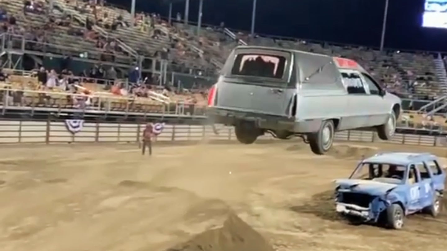 Watch This Cadillac Fleetwood Hearse Sprout Wings and Fly Over an SUV