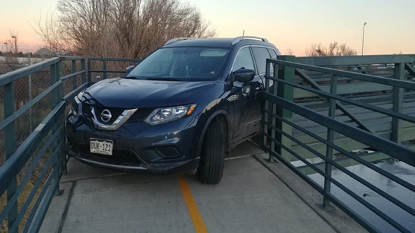 No One Knows How This Nissan Rogue Got Stuck on a Colorado Bike Bridge