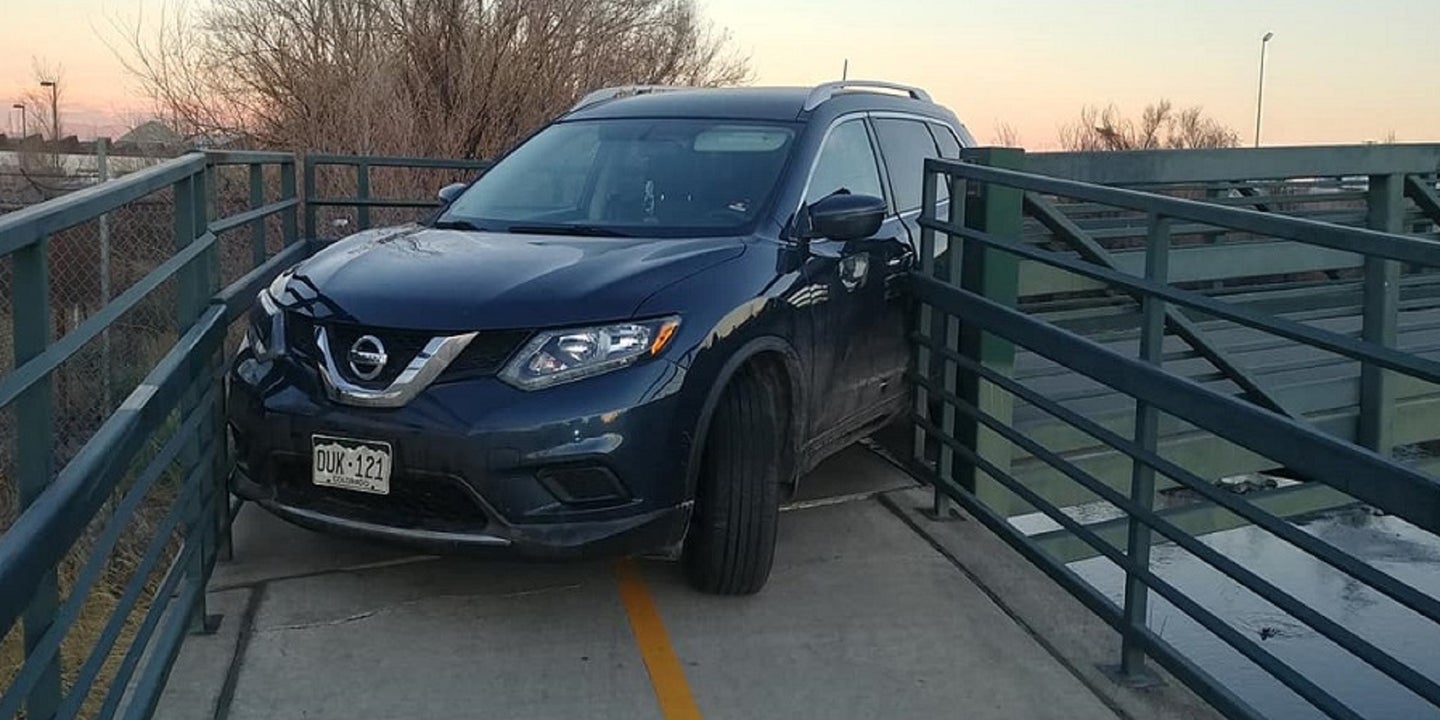 No One Knows How This Nissan Rogue Got Stuck on a Colorado Bike Bridge