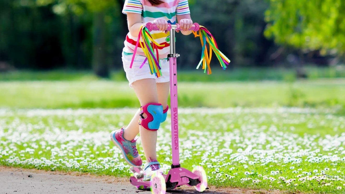 Girl Riding 3 Wheel Scooter