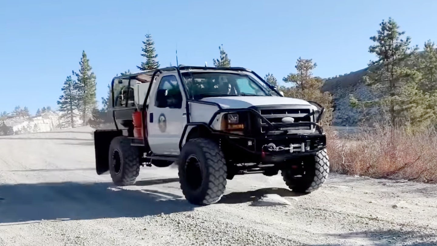 This Lifted and Caged Ford Super Duty’s Only Purpose Is to Service Toilets on the Rubicon Trail