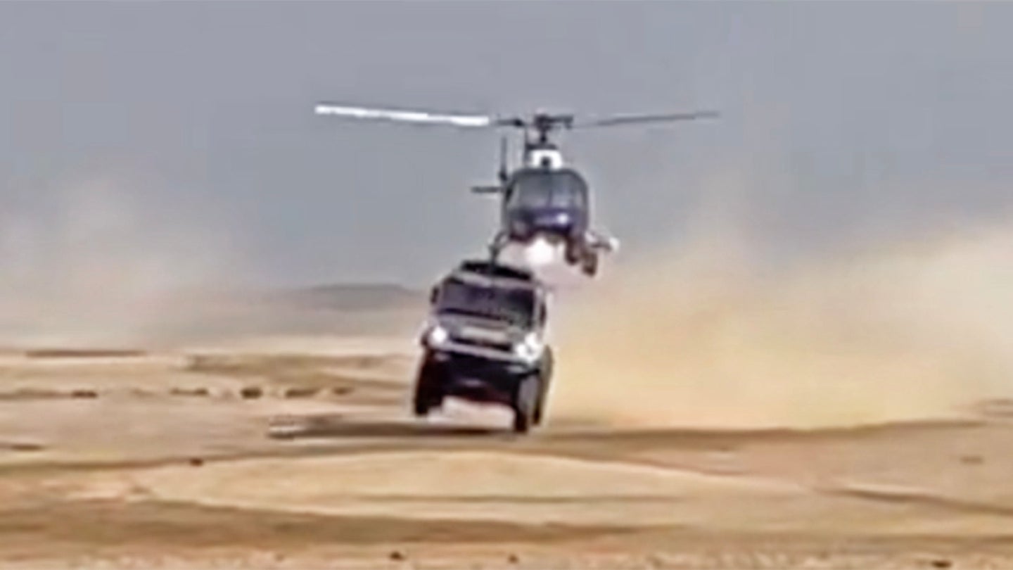 Watch a Helicopter Hit a Dakar Rally Truck Mid-Jump and Barely Avoid Catastrophe