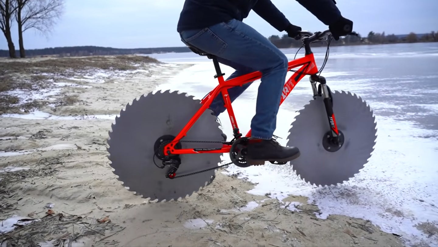 Biking on Giant Circular Saw Blades Is All Fun and Games Until You Wipe Out