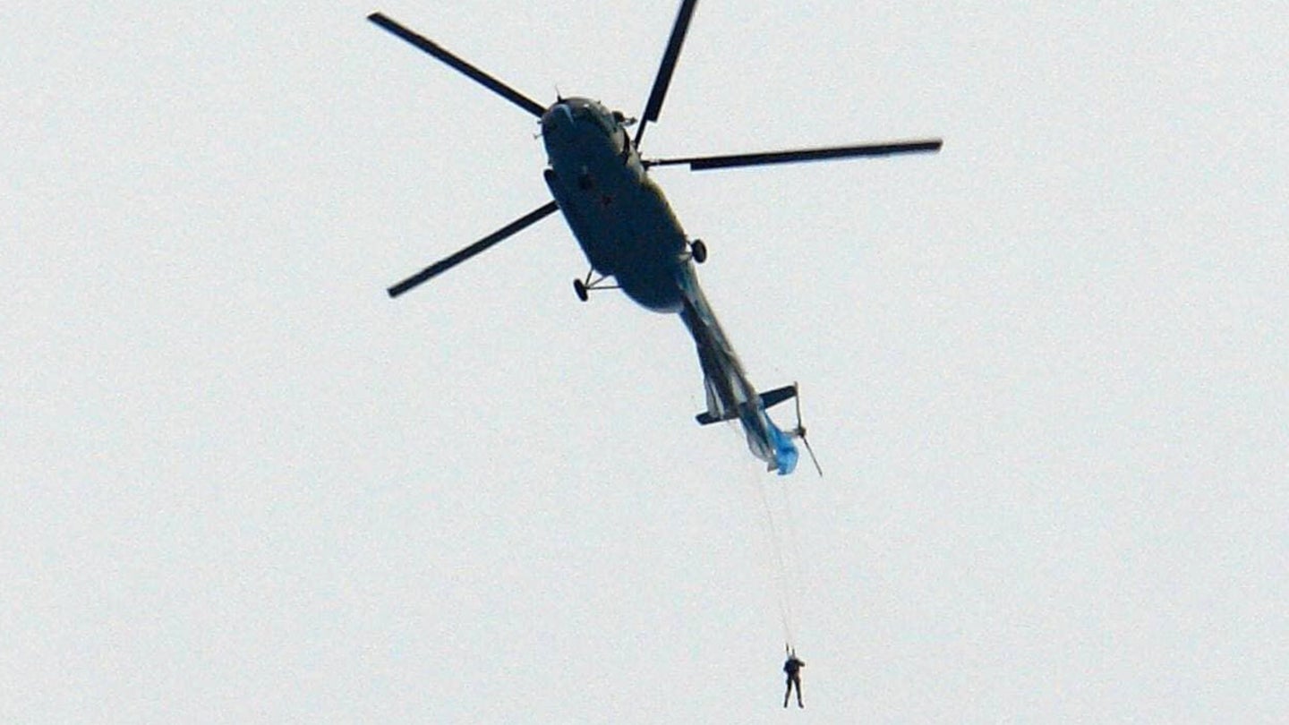 Parachute Snag Leaves Russian Soldier Dangling Perilously From Helicopter