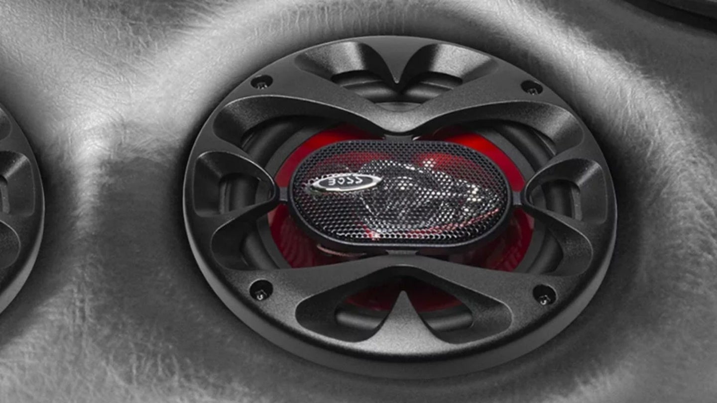 Close up shot of a round car speaker in a car