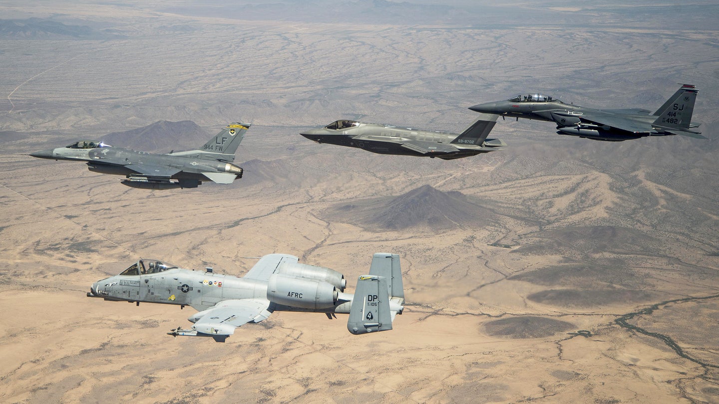 An A-10 Warthog, F-16C Viper, F-35A, and F-15E Strike Eagle fly together.