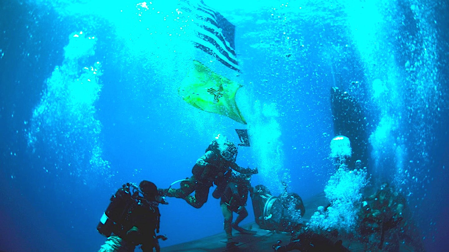 Check Out These Flag-Bearing Navy SEALs Training With A Submerged Submarine