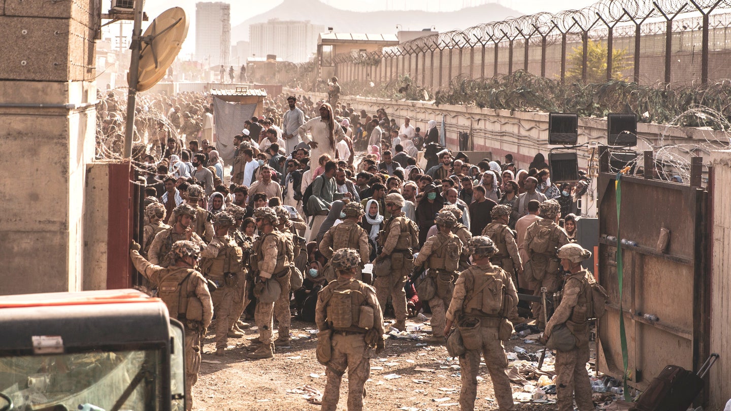 Marines operate a checkpoint at Hamid Karzai International Airport on Aug. 21, 2021.