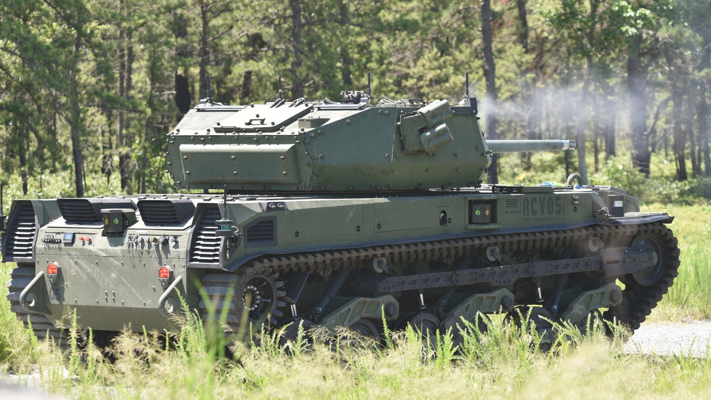 One of the Army's Ripsaw M5 unmanned ground vehicles fires its M240 machine gun during live-fire testing at Fort Dix, New Jersey, on July 30, 2021.