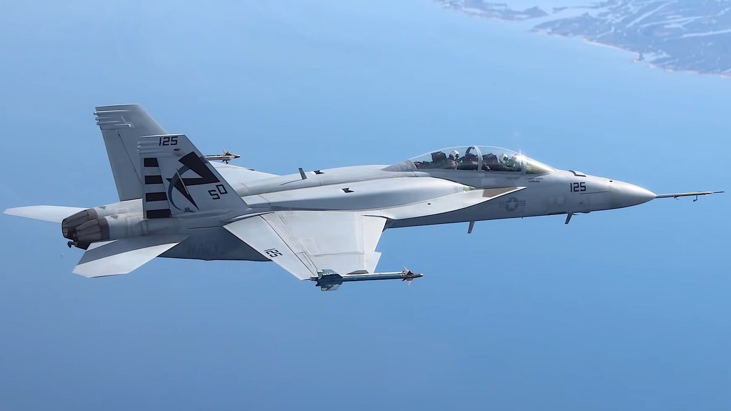 A Navy F/A-18F Super Hornet fitted with conformal fuel tanks, or CFTs, during testing.