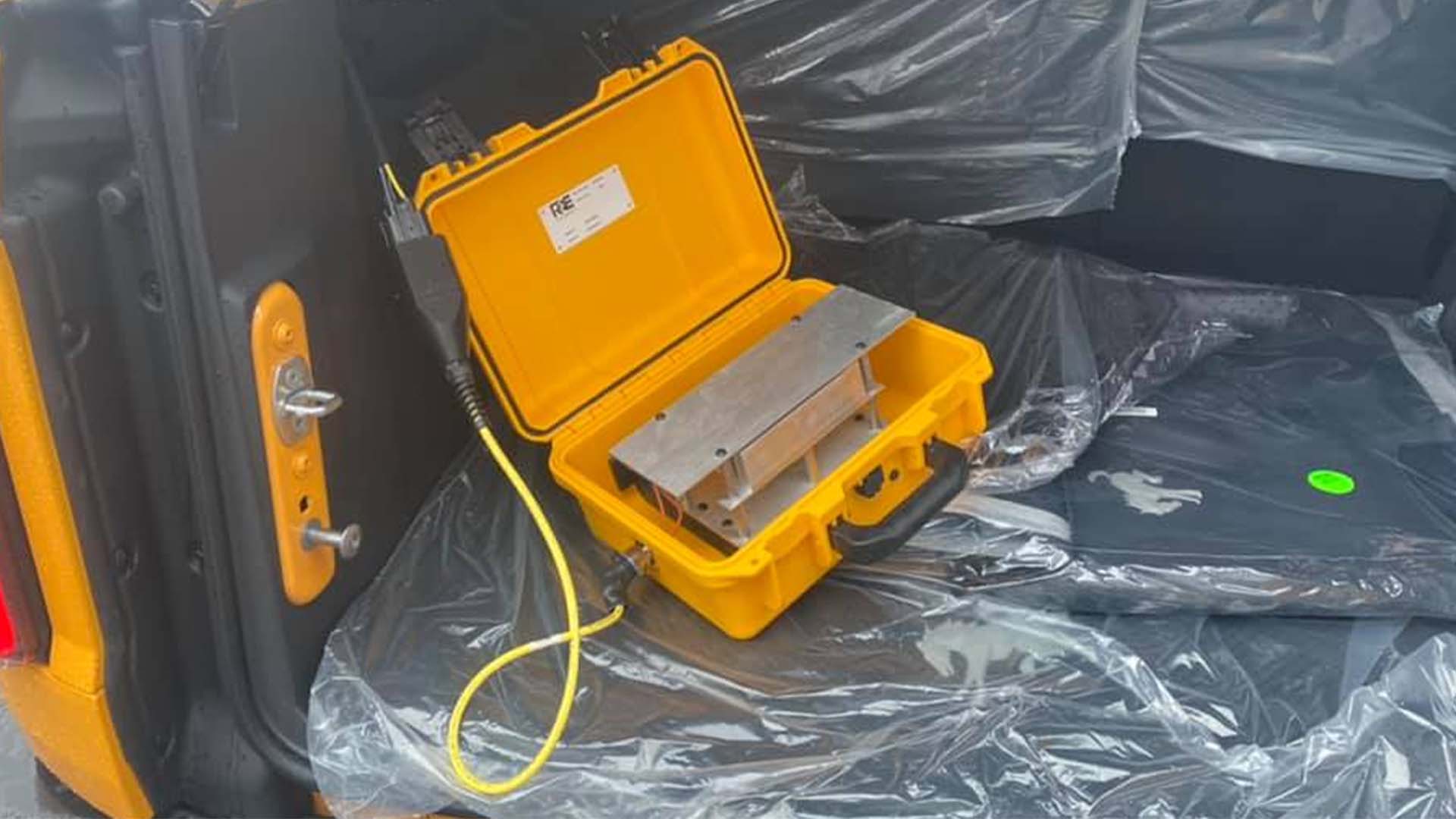 A Canadian Ford dealership found a surprise in the trunk of a 2021 Ford Bronco that was recently delivered to its showroom. This mystery box plugged i