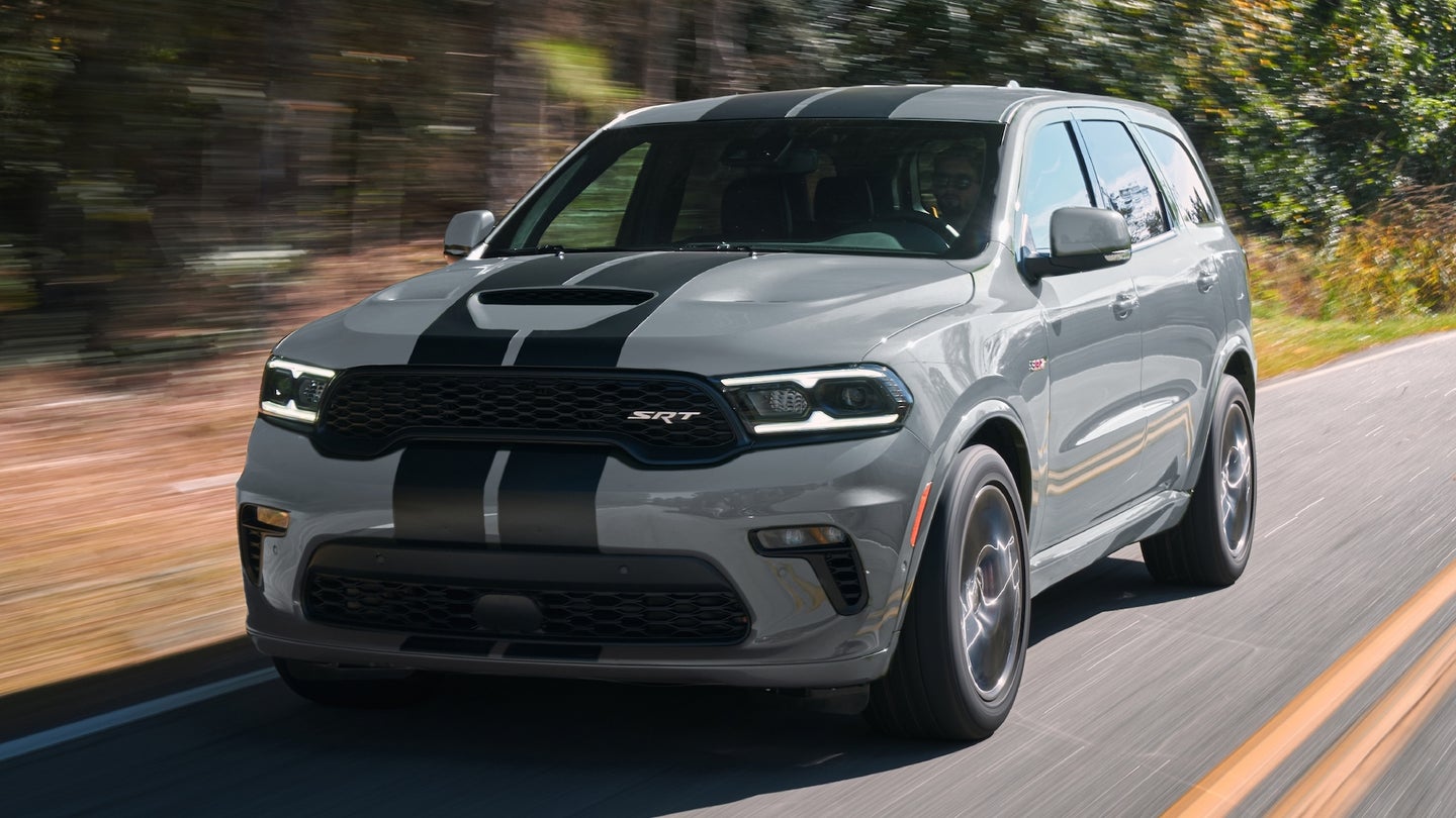 2022 Dodge Durango SRT 392: Equipped with the 392-cubic-inch HEMI V-8 delivering 475 horsepower and 470 lb.-ft. of torque, the Durango SRT 392 features aggressive exterior styling and a driver-centric cockpit, shown here in Destroyer Grey with Dual Low Gloss Gunmetal stripes.