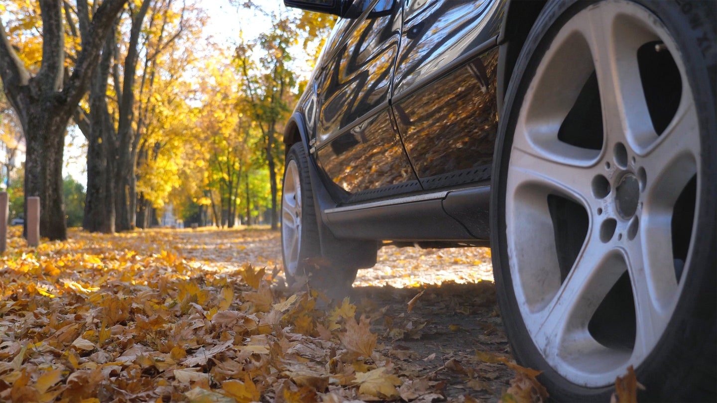 car on autumn road
