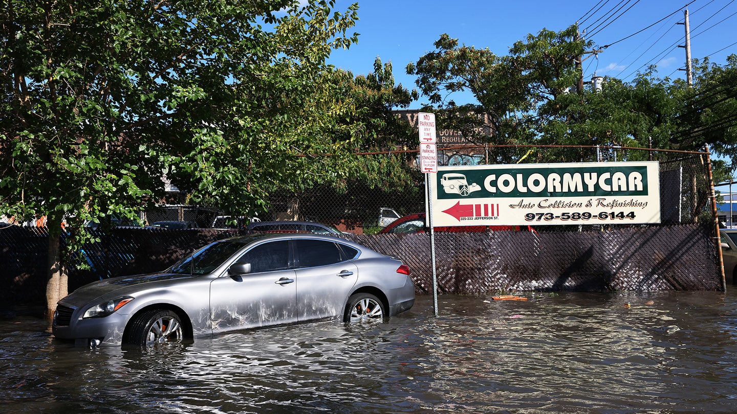 An Infiniti sits in flood waters in NYC.