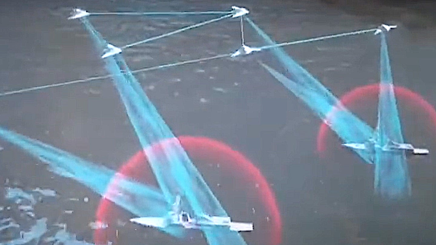 A screenshot of a segment from China's CCTV-7 showing a portion of a video presentation from state aviation conglomerate AVIC depicting stealth drones swarming a part of warships.