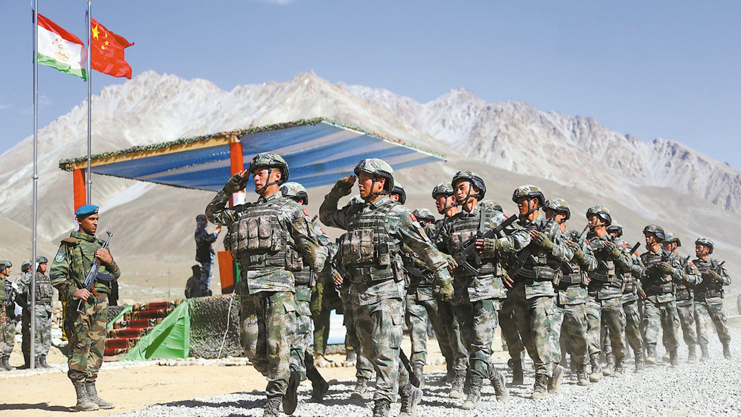 Chinese troops march in review during an exercise in Tajikistan in 2019.