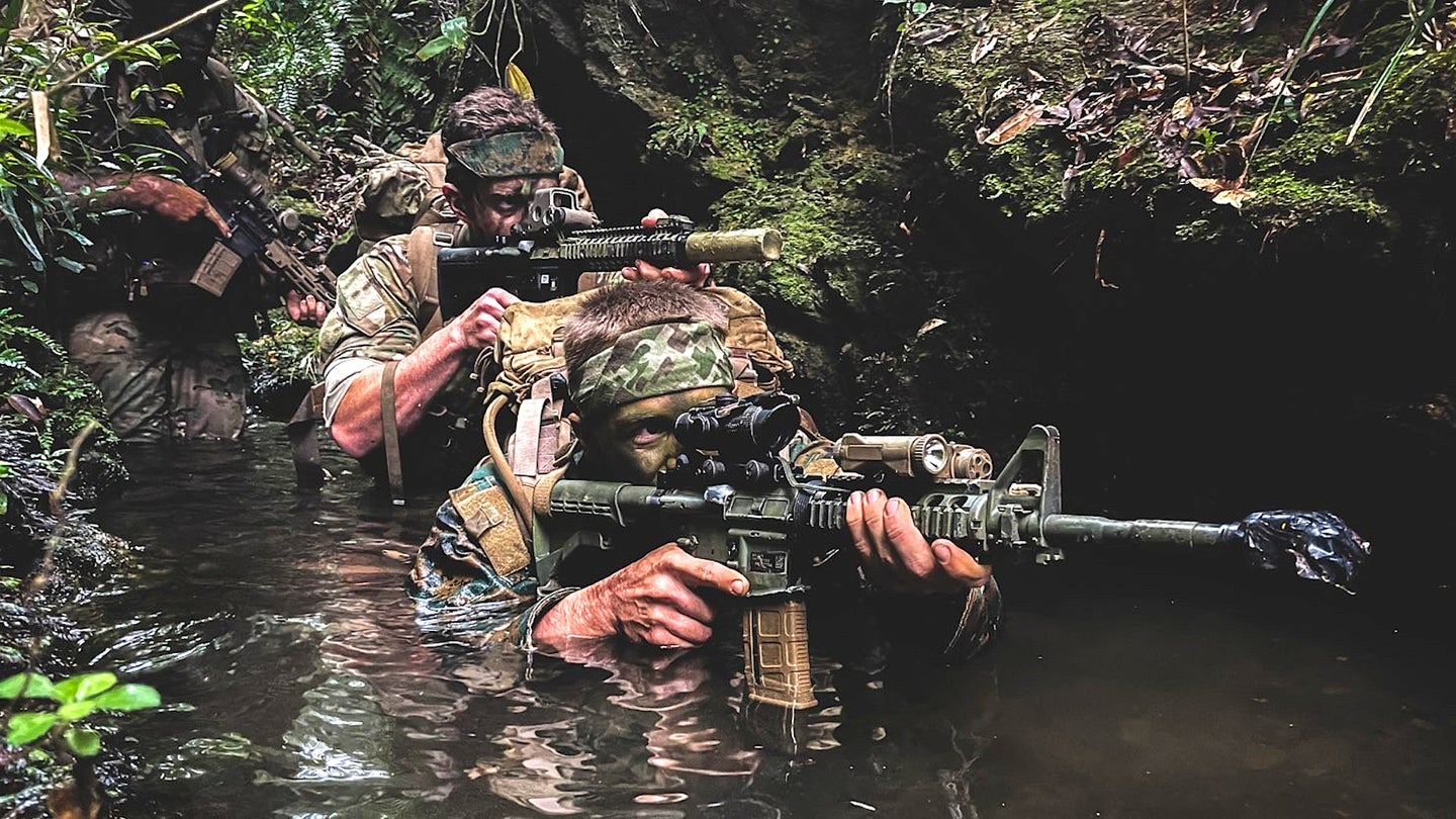 US Army Green Berets and US Marines take part in a jungle warfare training course in Japan.