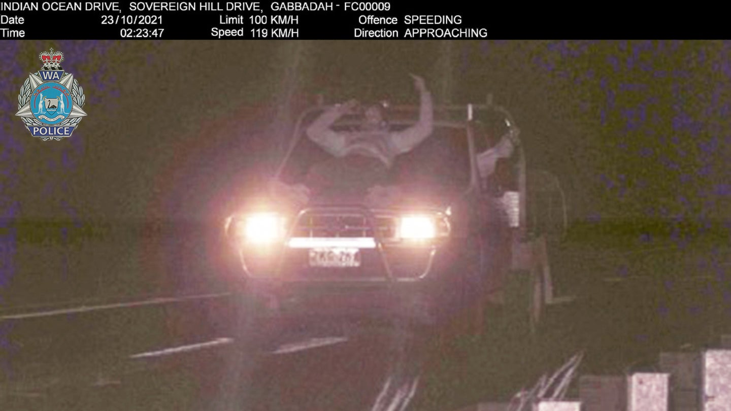 Speed Camera Catches Aussie Man Riding on the Hood, Having a Beer at 74 MPH