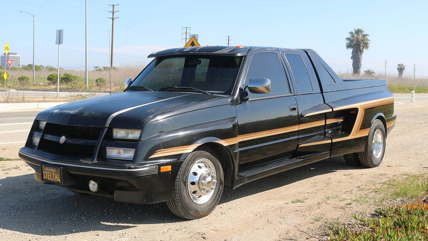 There’s a 1990 GMC Dually Pickup Buried Under All This Fiberglass
