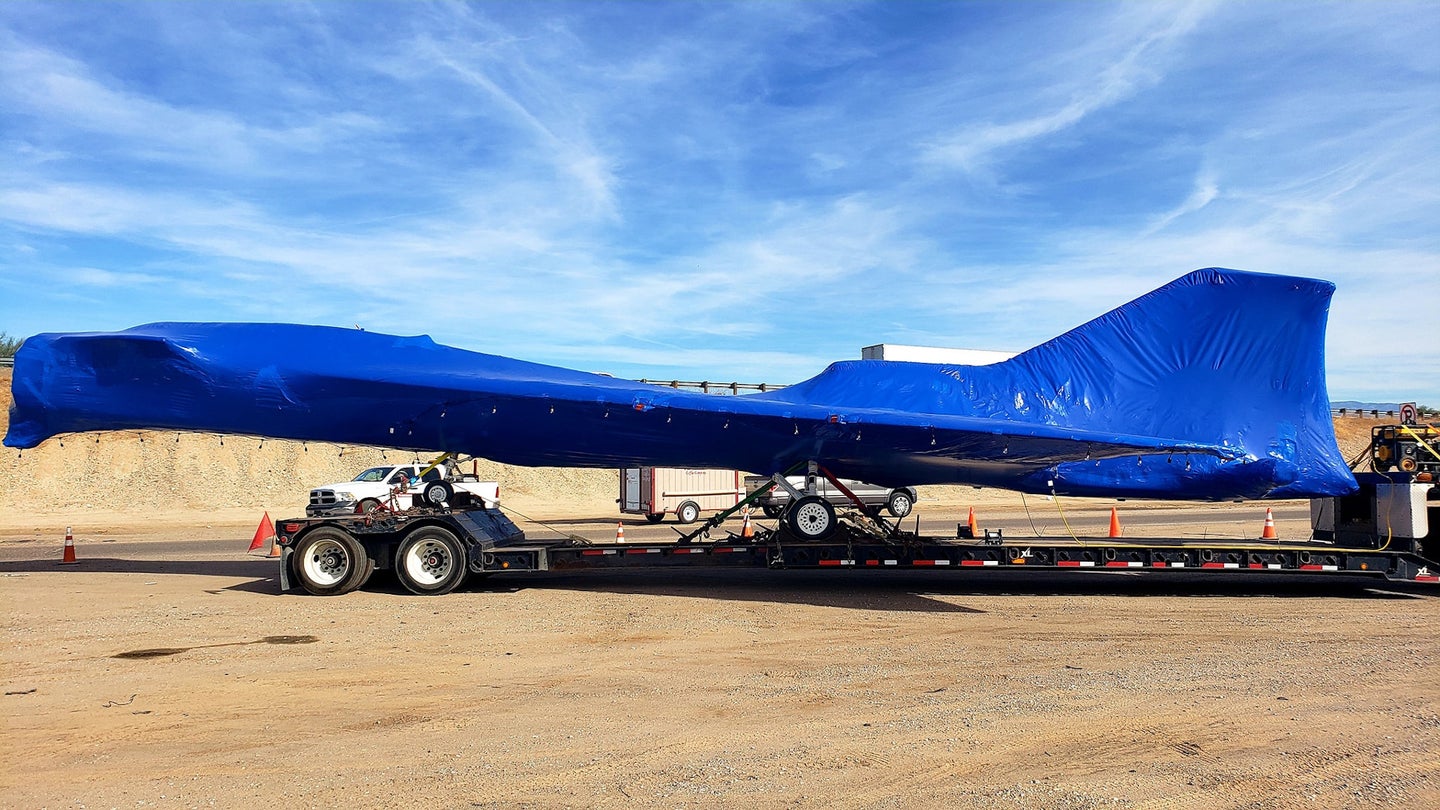 Lockheed Martin's X-59 Quiet Supersonic Technology testbed aircraft on a trailer headed for Fort Worth, Texas.