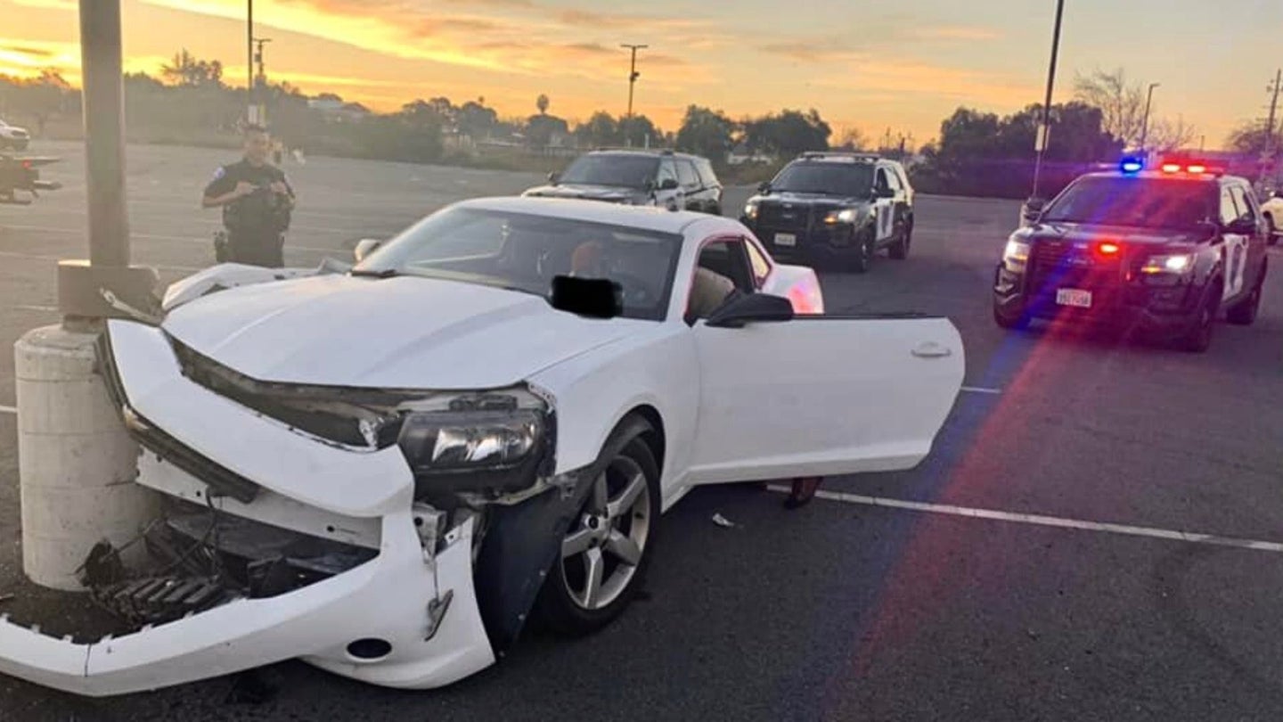 Chevy Camaro Driver Tries Doing Donuts in Empty Lot, Crashes Into Pole, Gets Arrested