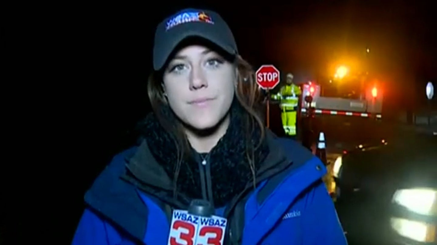 Tough Newscaster Bumped by a Car on Live TV and She Pops Right Back Up