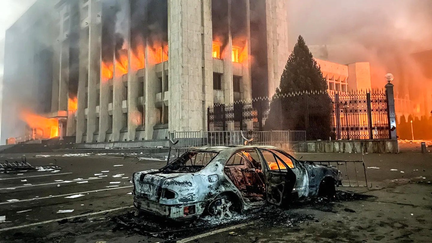 A government building in the Kazakh city of Almaty burns during an outbreak of civil unrest in January 2022.