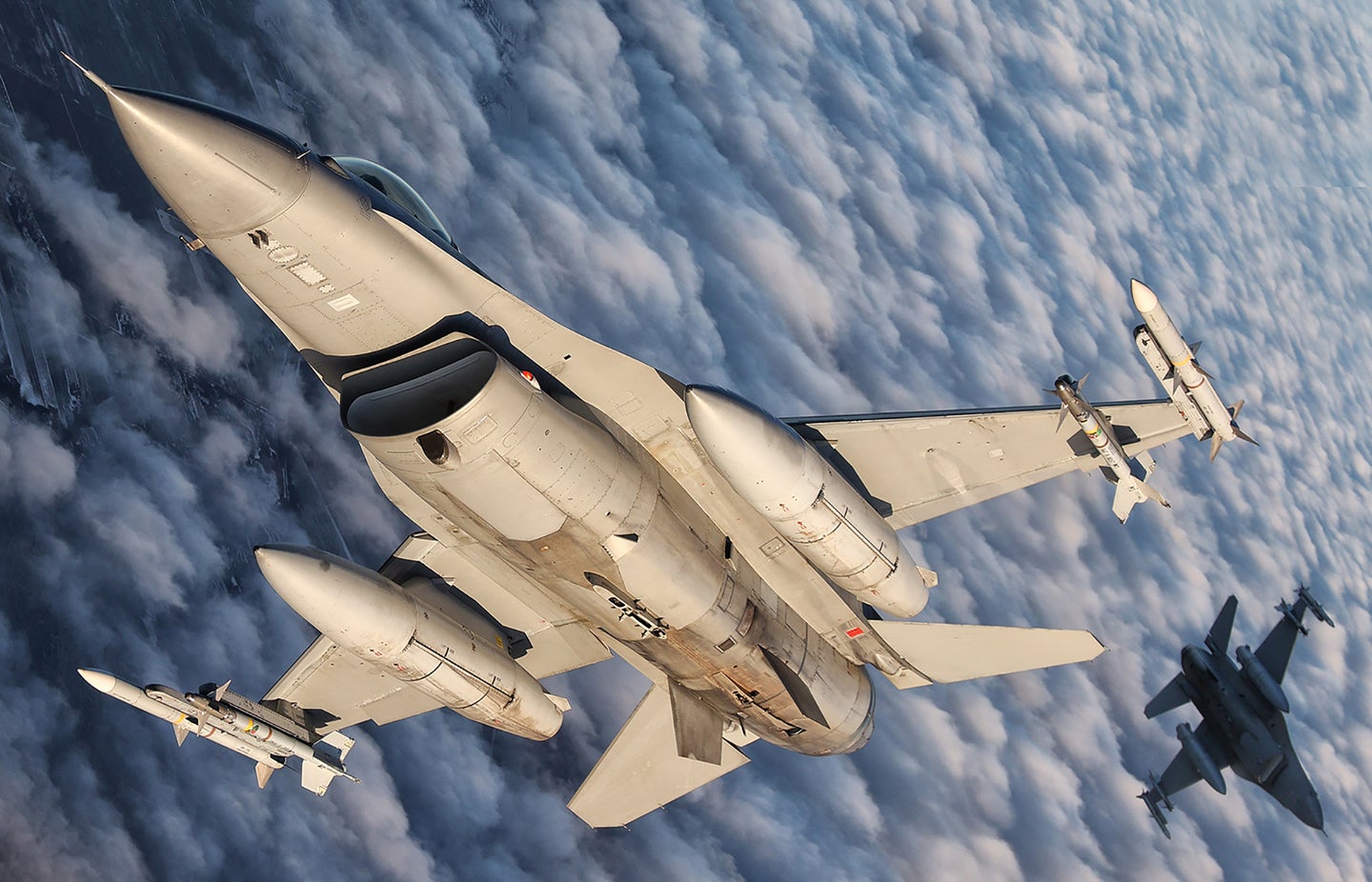 These Photos Of Armed NATO F-16s Patrolling Over The Baltics Are Absolutely Incredible
