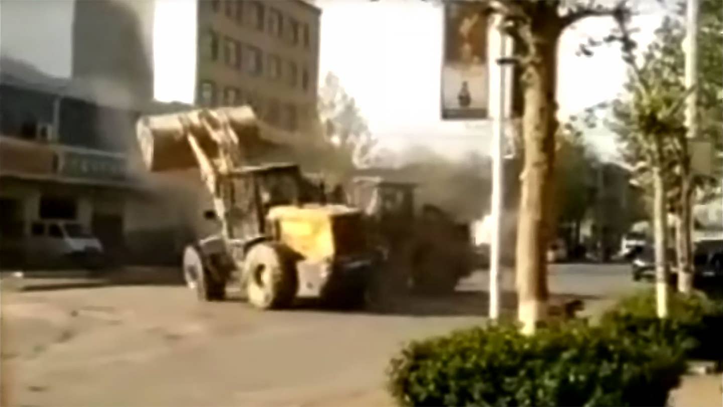 Watch 6 Bulldozers and Forklifts Fight It Out in China