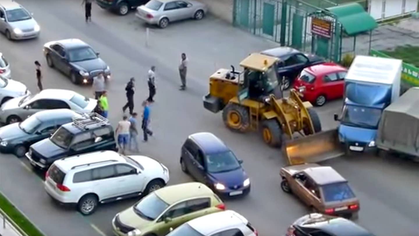 Watch a Russian Front-End Loader Destroy a Parking Lot Full of Cars