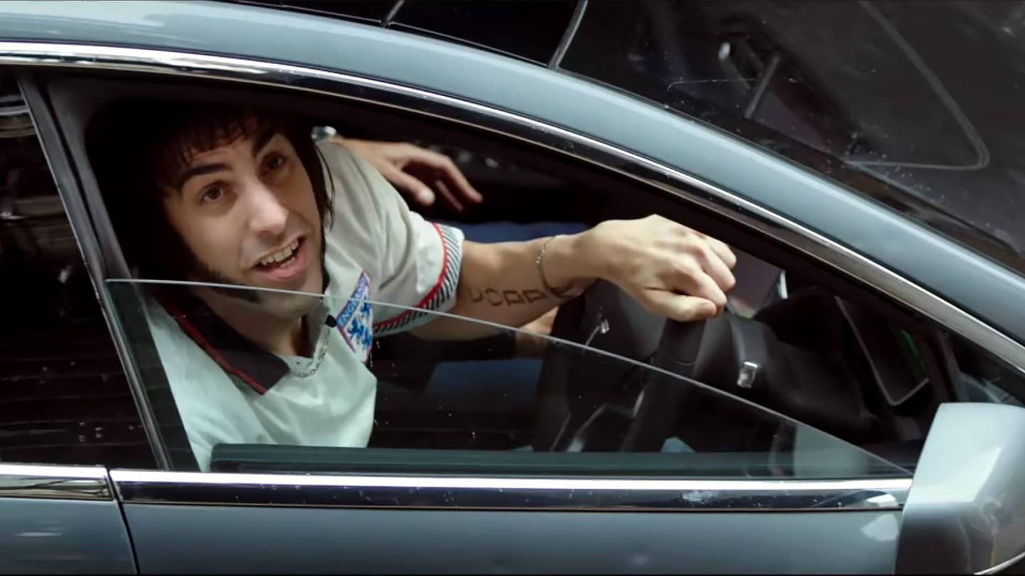 There’s a Bulletproof Tesla in the New <em>Brothers Grimsby</em> Trailer