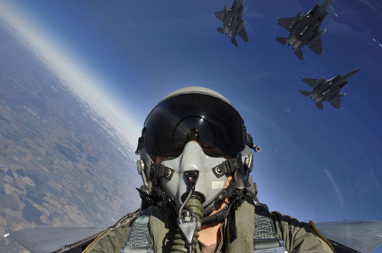 1280px-self_cockpit_view_and_three-ship_formation_of_f-15e.jpg