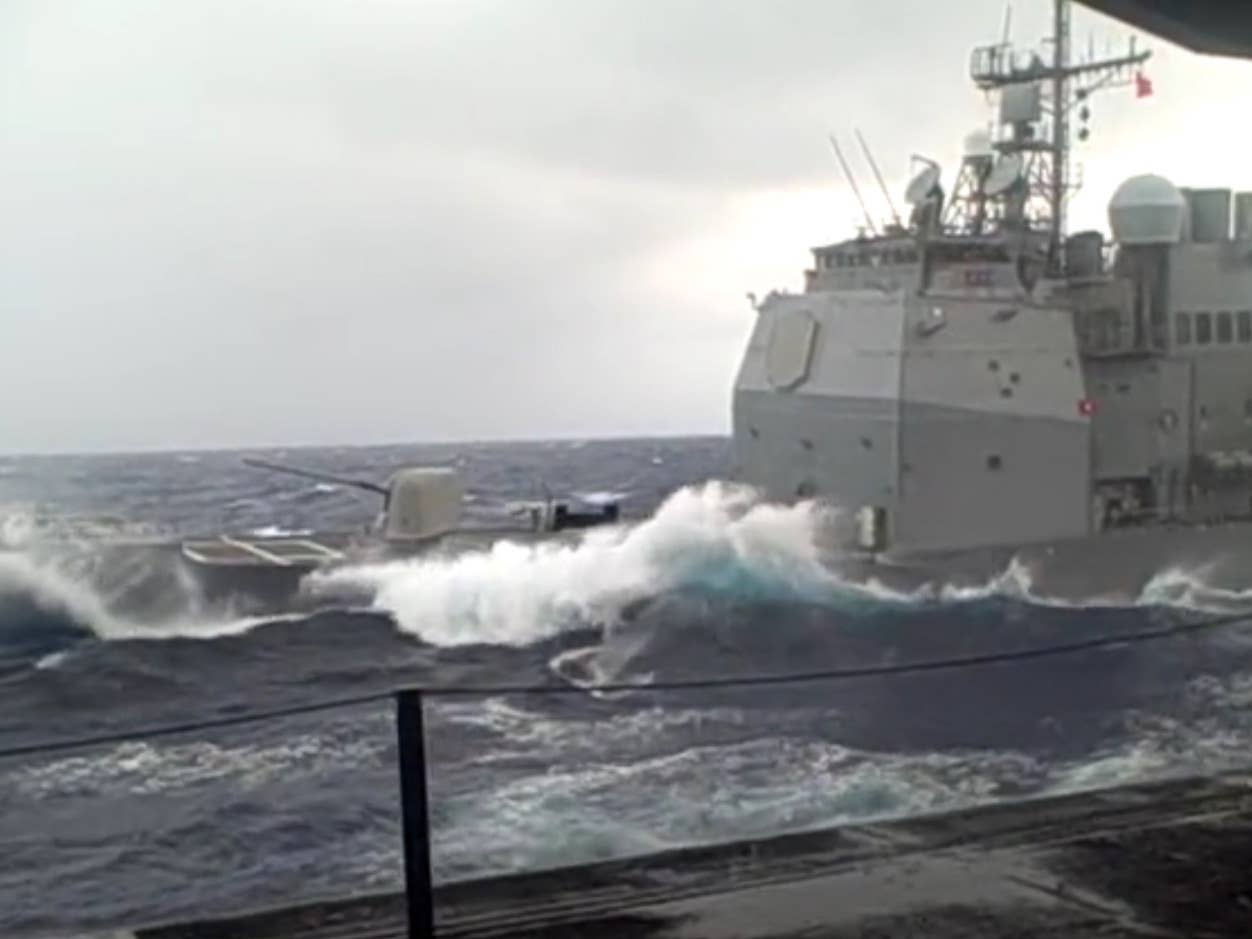 This Navy Cruiser Plows Through Some Nasty Swells Like A Boss
