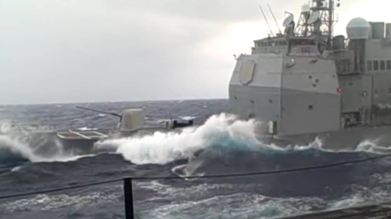 This Navy Cruiser Plows Through Some Nasty Swells Like A Boss