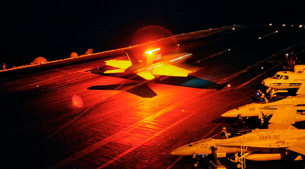 defense.gov_news_photo_101122-n-6003p-460_-_an_f_a-18f_super_hornet_assigned_to_strike_fighter_squadron_32_catches_the_arresting_wire_aboard_the_aircraft_carrier_uss_harry_s._truman_cvn_75.jpg