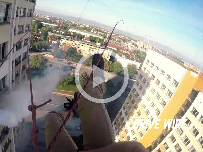 Drive Wire: Watch These Daredevils Swing Between Two 18 Story Buildings