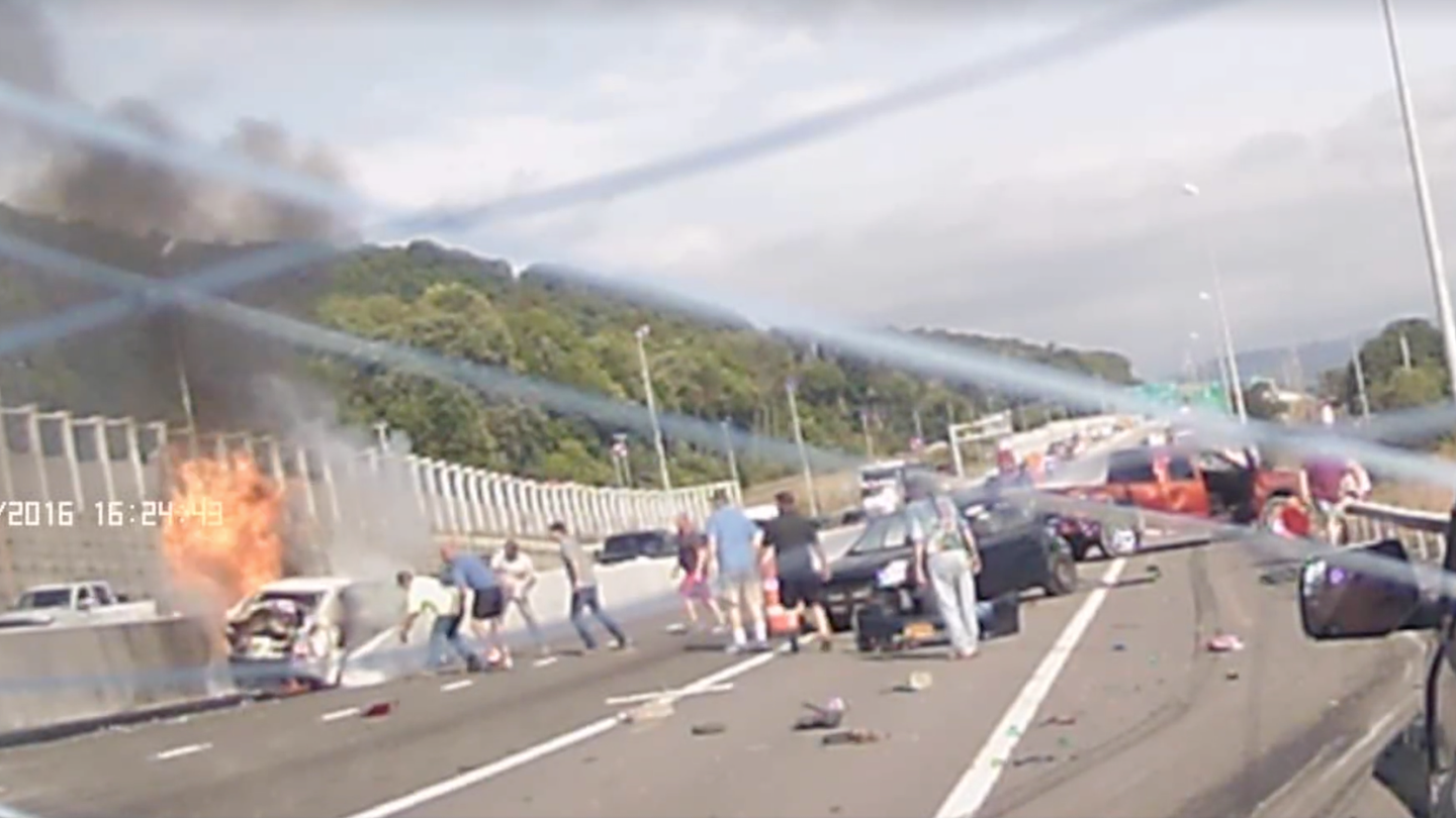 Watch These Heroes Pull a Woman From a Burning Car After a Massive Crash