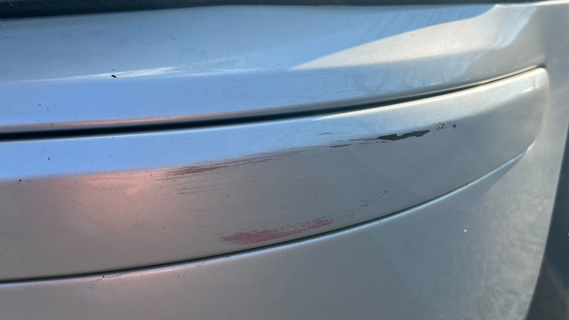 How to remove small scratches from a black car without taking it