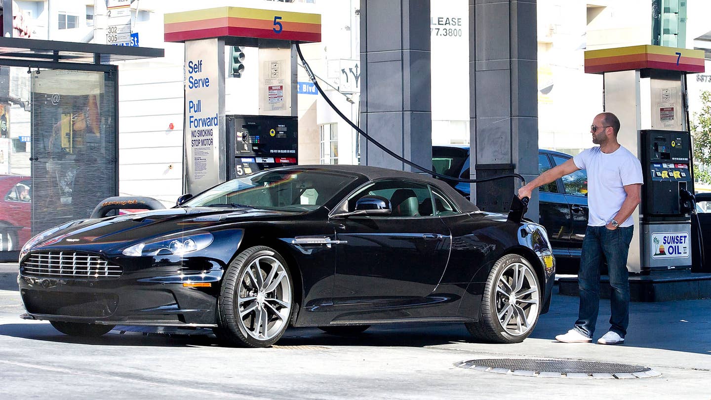 Jason Statham gassing up an Aston Martin in LA.