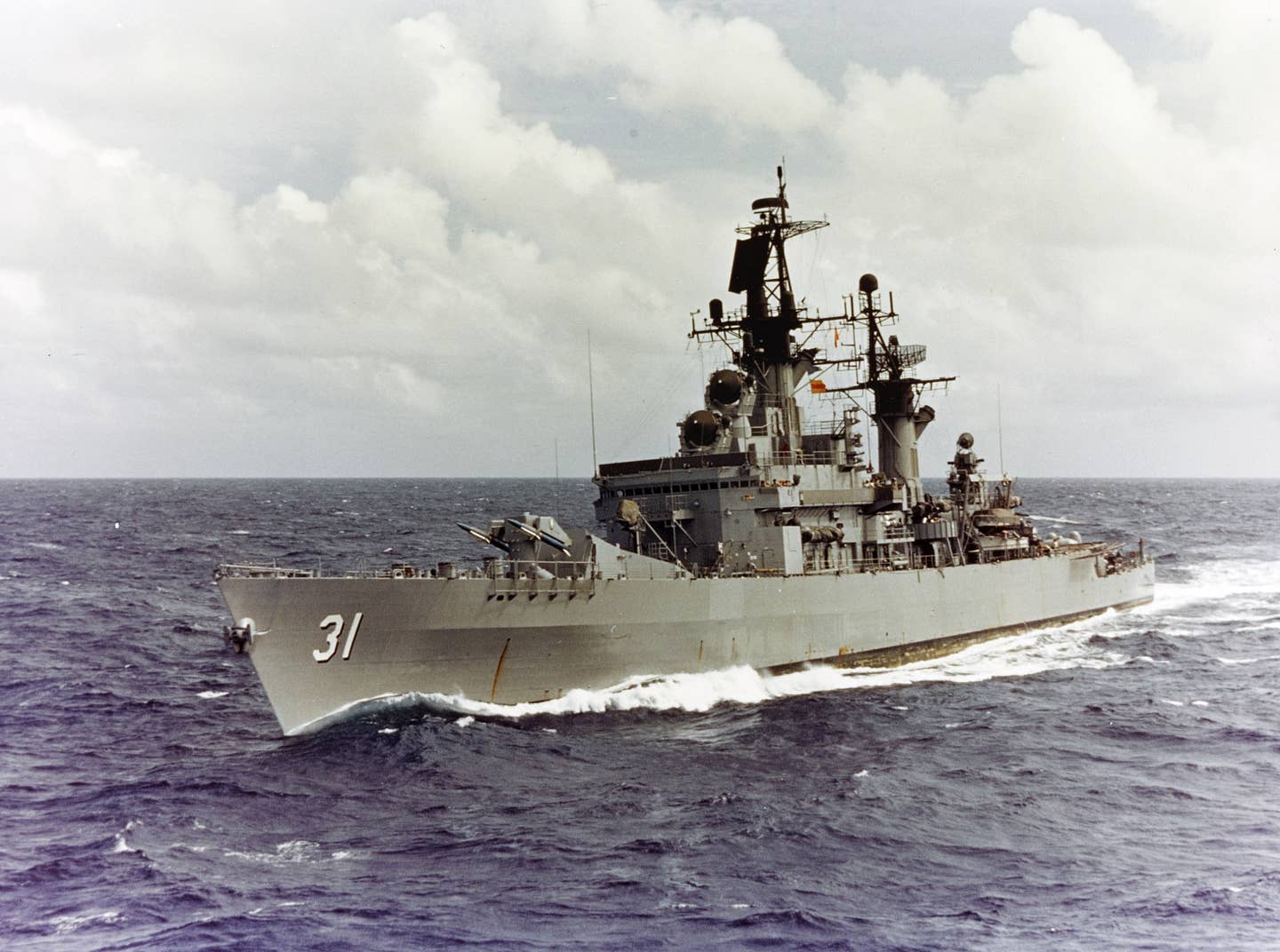 The U.S. Navy destroyer-leader (later classified as a guided-missile cruiser) USS <em>Sterett</em> underway in the Pacific in January 1972. Note the forward twin-arm launcher for Terrier missiles. Credit: U.S. Navy