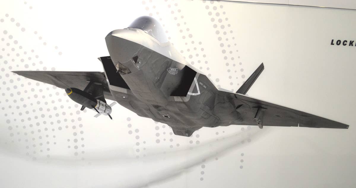 An artist's conception of an F-35C Joint Strike Fighter carrying a missile based on Lockheed Martin's HAWC design under its wing. <em>Joseph Trevithick</em>