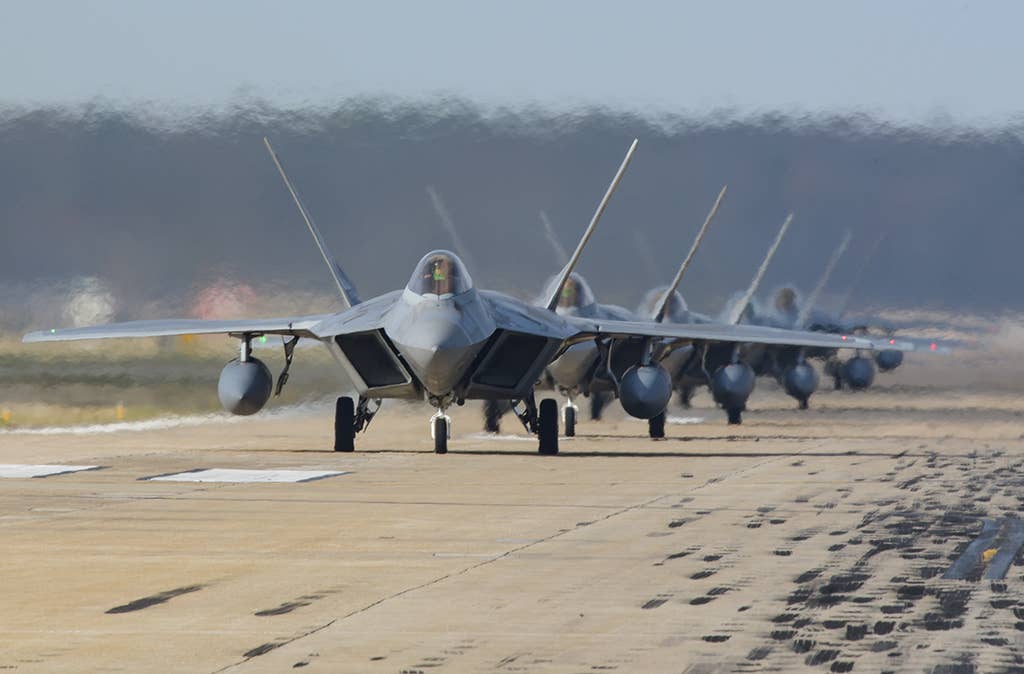 F-22 Raptors from the 1st Fighter Wing and 192nd Fighter Wing, participate in a total force "elephant walk" exercise at Joint Base Langley-Eustis, Virginia, Feb. 28, 2018.  (Credit: USAF)