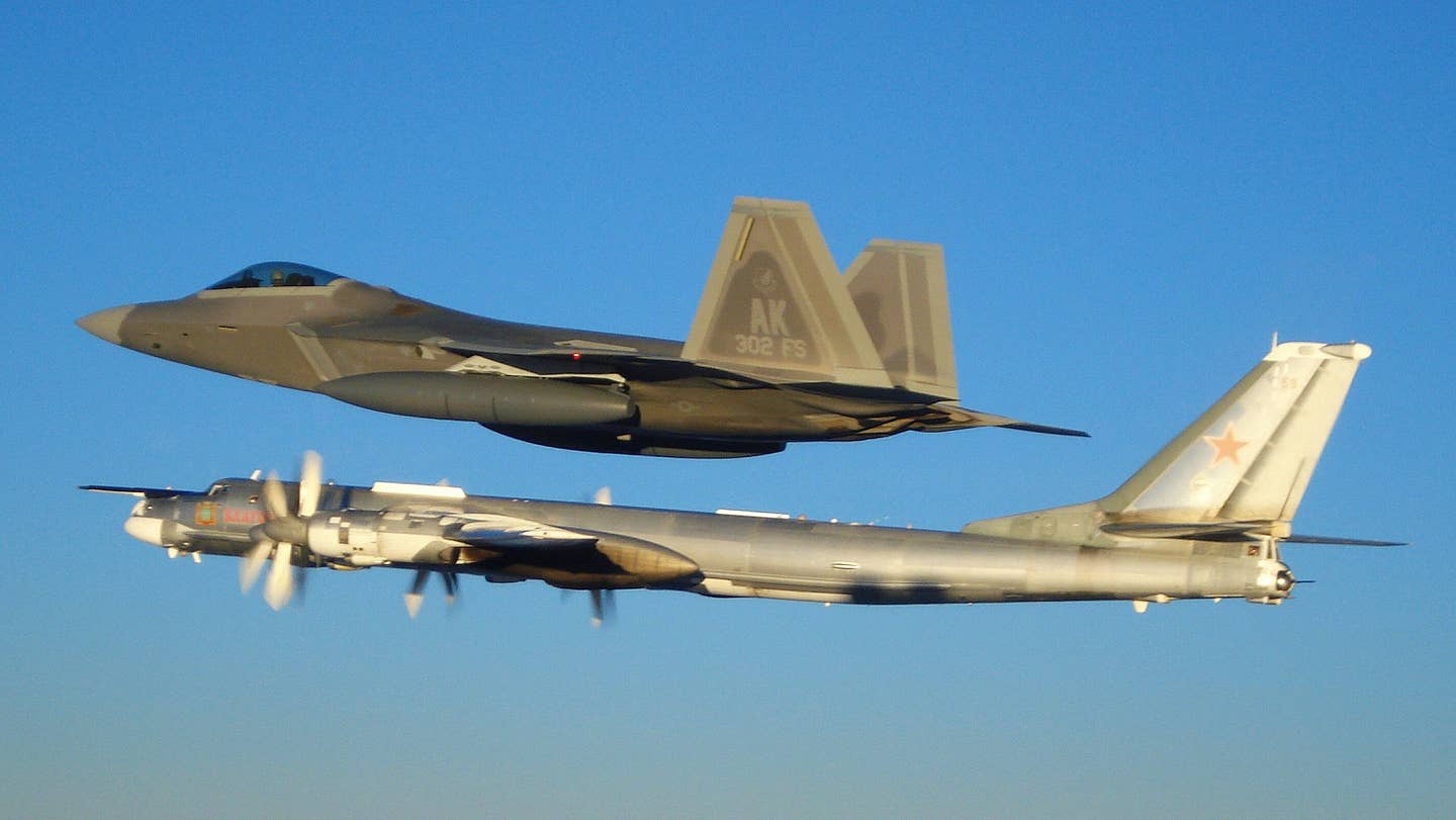 Two F-22 Raptors from 11th Air Force, 3rd Wing, based at Elmendorf Air Force Base, Alaska intercepted a pair of Russian Tu-95MS strategic bombers on November 22, 2007.  The F-22s wear 600-gallon tanks for their alert mission out of Anchorage. (US Air Force photo)